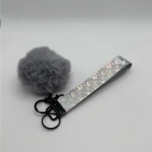 Shiny Silver Wristlet Keychain with Gray Pom Pom